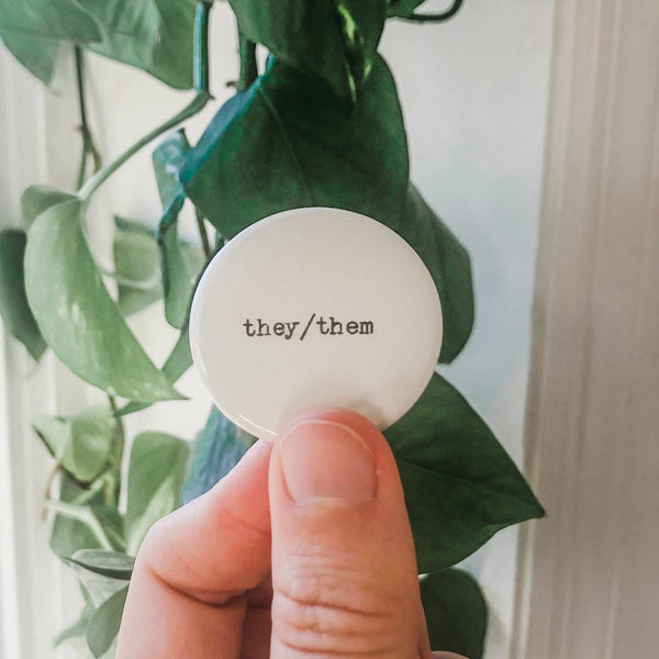 they/them pronouns typed in typewriter font on a white background, 1.5 inch pinback button 